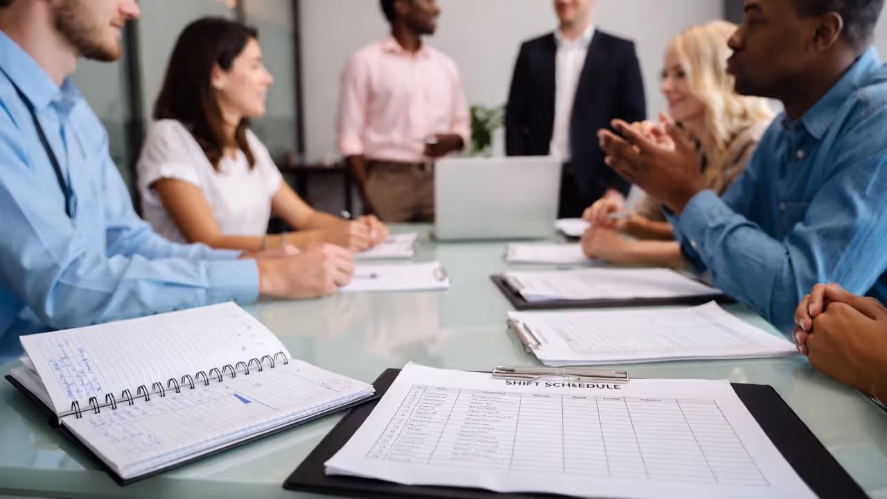 Small business owner coordinating employees and HR tasks in a growing team