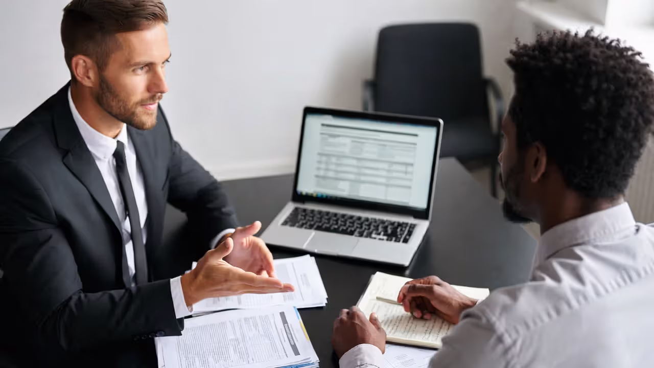 Manager and employee reviewing performance goals and a development plan